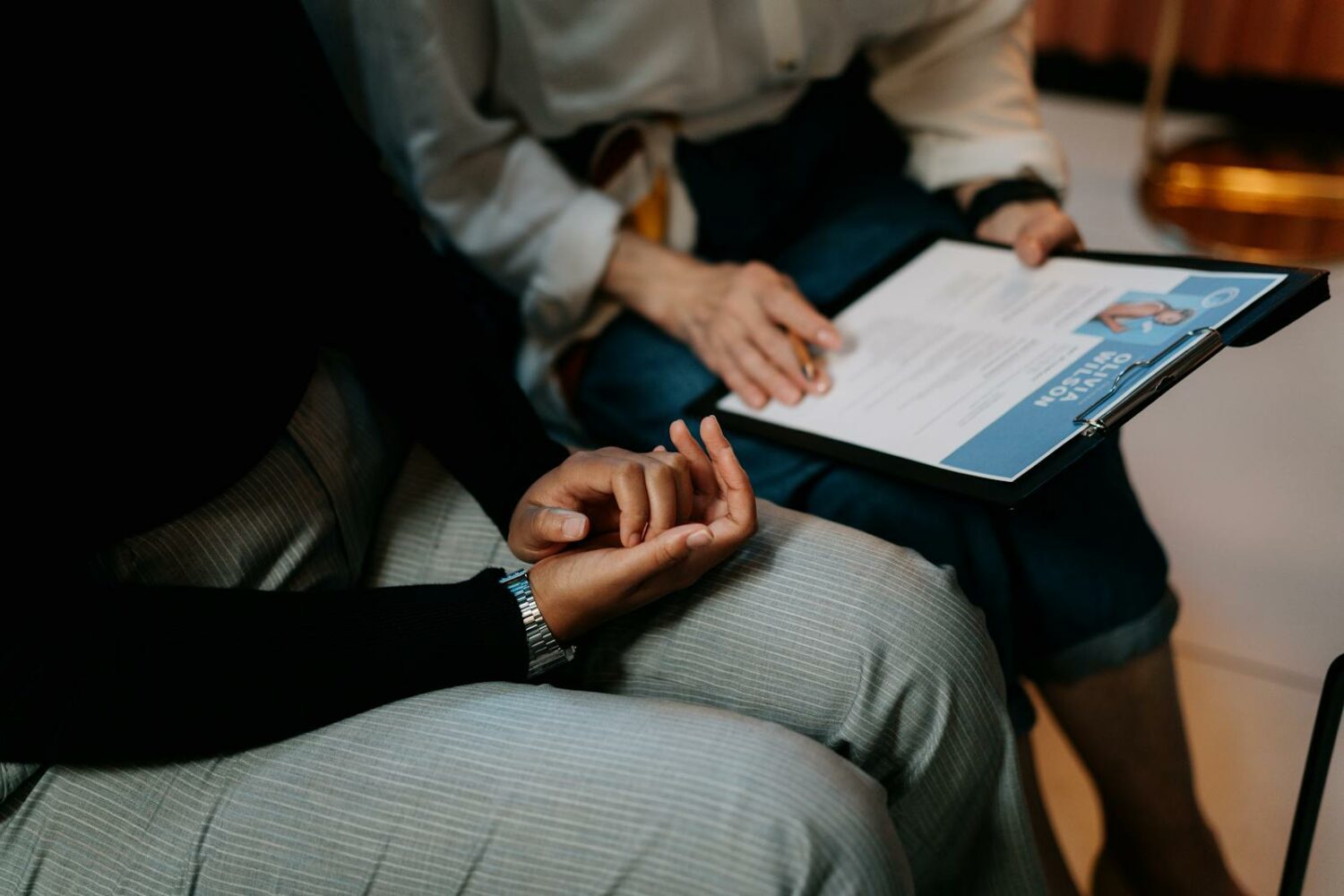 Photo by cottonbro studio Person in White Long Sleeve Shirt Holding a Clipboard with Resume